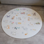 Afrikaans Alphabet play mat on a concrete floor.