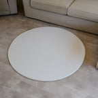 Sage play mat with a herringbone pattern on a concrete floor.