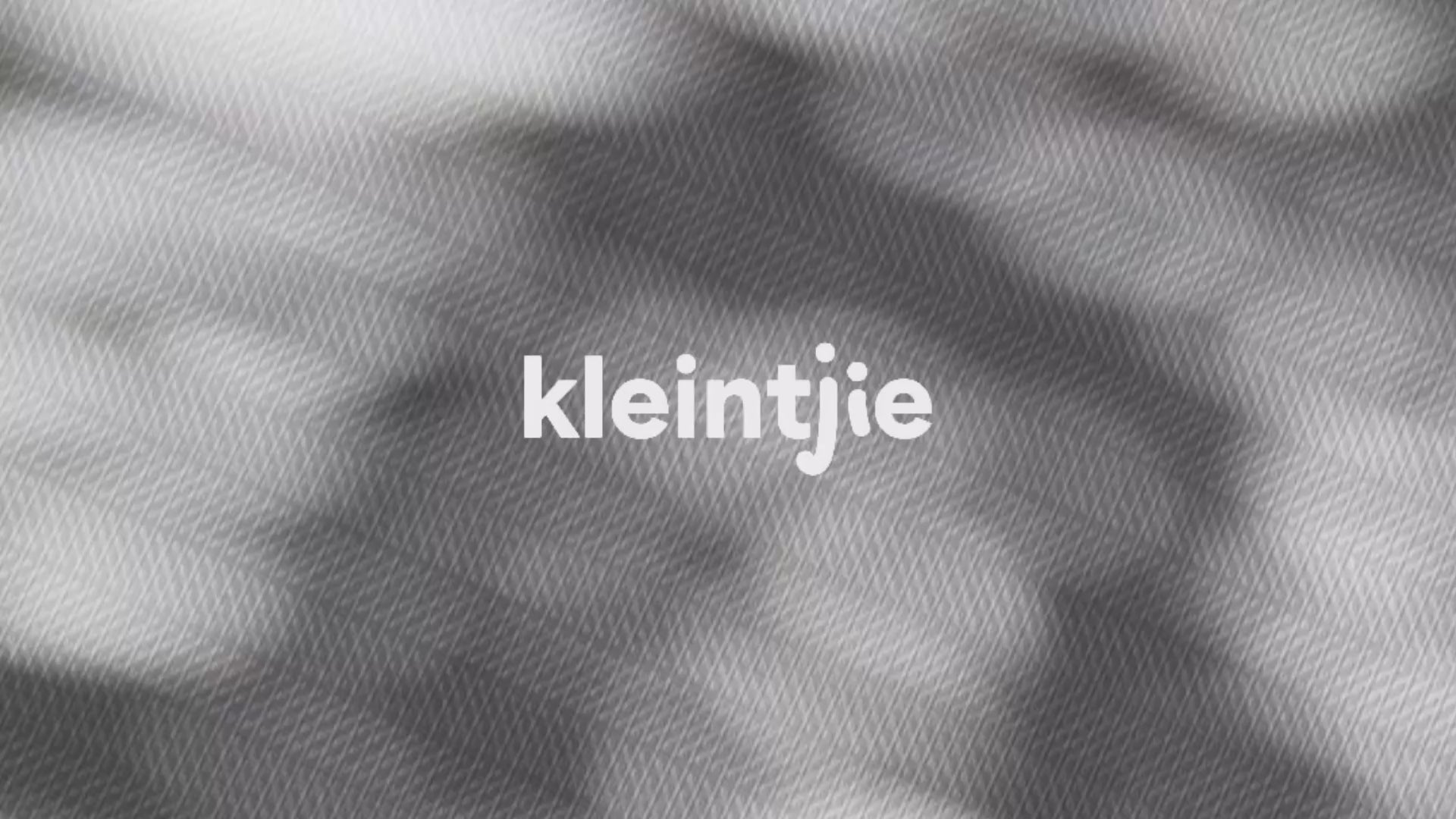 Kleintjie video showcasing different play mats with a baby crawling and playing